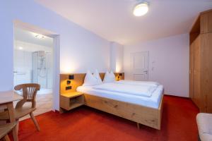 Posteľ alebo postele v izbe v ubytovaní Chalet Georg