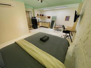 Un ou plusieurs lits dans un hébergement de l'établissement Q apaz Serviced Apartment - 45TL
