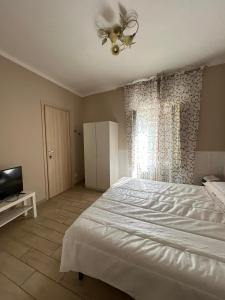 Postel nebo postele na pokoji v ubytování B&B " La Casetta "