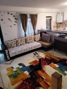 a living room with a couch and a table at Casa de inchiriat in Vaslui in Vaslui