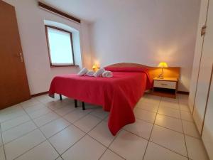 Postel nebo postele na pokoji v ubytování Albergo Martina