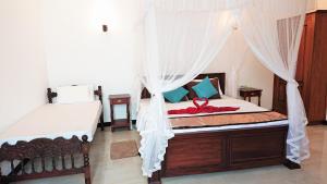 Postel nebo postele na pokoji v ubytování Tropical Inn