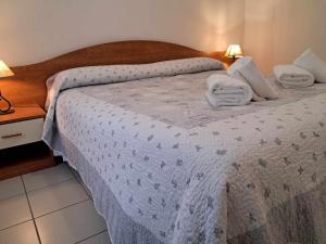 Postel nebo postele na pokoji v ubytování Albergo Martina