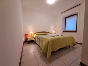 Postel nebo postele na pokoji v ubytování Albergo Martina