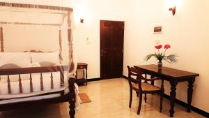 Postel nebo postele na pokoji v ubytování Tropical Inn