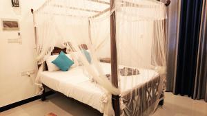 Postel nebo postele na pokoji v ubytování Tropical Inn