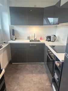 a kitchen with a sink and a counter top at MyHome-Tiny -stilvollen Ruhepol in Lüdinghausen