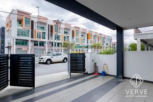a view of a parking lot with a white car at Ipoh Luxury Suites by Verve (18 Pax) EECH16 in Ipoh