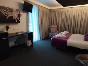 Кровать или кровати в номере Hotel Playa Ribera
