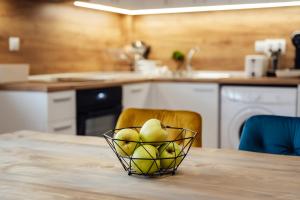 a bowl of fruit on a table in a kitchen at VILLA MEDI boutique in Sapareva Banya