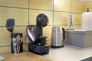 Η κουζίνα ή μικρή κουζίνα στο Relax Home Downtown Apartment