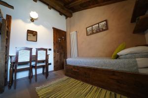 Letto o letti in una camera di RUSTICO VIGNA casa vacanze