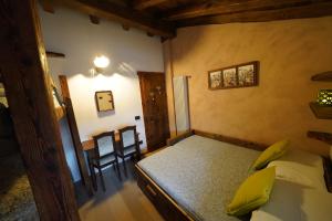 Letto o letti in una camera di RUSTICO VIGNA casa vacanze
