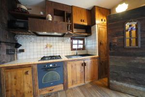 Cucina o angolo cottura di RUSTICO VIGNA casa vacanze