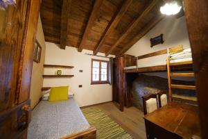 Letto o letti in una camera di RUSTICO VIGNA casa vacanze
