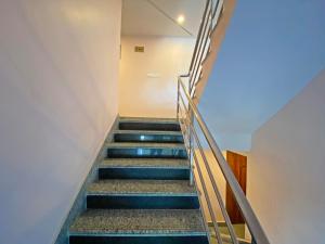 a staircase in a building with blue steps at Hotel White Rabbit in Kathmandu