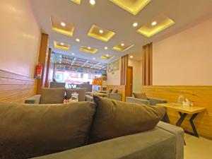 a living room with a couch and a table at Hotel White Rabbit in Kathmandu