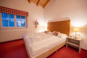 Postel nebo postele na pokoji v ubytování All Seasons Lodge by All in One Apartments + 37 fotografií