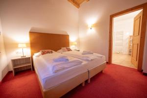 Postel nebo postele na pokoji v ubytování All Seasons Lodge by All in One Apartments
