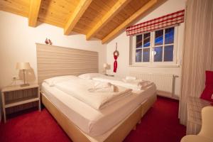 Postel nebo postele na pokoji v ubytování All Seasons Lodge by All in One Apartments