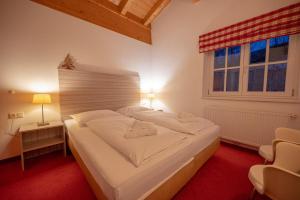Postel nebo postele na pokoji v ubytování All Seasons Lodge by All in One Apartments