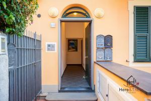 a hallway of a house with an open door at [Varazze Center] Free Parking • WiFi • Disney+ in Varazze