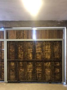a garage with wooden walls and a light on the ceiling at La Higuera con Parking B in Azul
