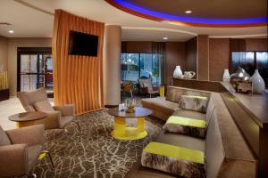 a living room with a couch and a table at SpringHill Suites Savannah Airport in Savannah