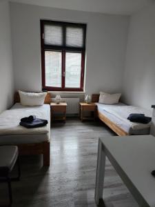 Postel nebo postele na pokoji v ubytování Unterkunft Greifswald
