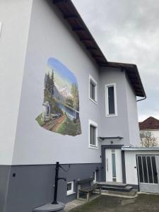 a building with a mural on the side of it at Wohnung in Haus in Neunkirchen