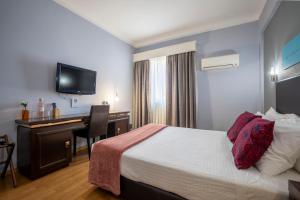 Postel nebo postele na pokoji v ubytování Hotel Onix