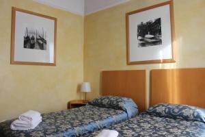 Postel nebo postele na pokoji v ubytování Club Hotel