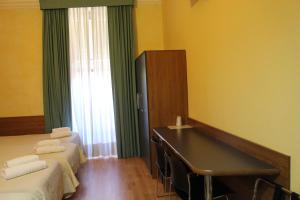 Postel nebo postele na pokoji v ubytování Club Hotel