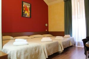 Postel nebo postele na pokoji v ubytování Club Hotel