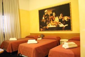 Postel nebo postele na pokoji v ubytování Club Hotel