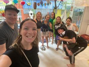 a group of people posing for a picture at Bonjour Hostel in Hue
