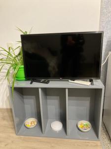 a flat screen tv sitting on a entertainment center at Cozy loft apartment in Pleven