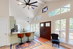 a kitchen with a ceiling fan and some chairs at Holly Lake Ranch Retreat in Rhonesboro
