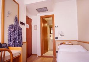 Кровать или кровати в номере Hotel Florida Lerici