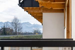 a view of mountains from a window of a building at Kominkowy Chill in Biały Dunajec