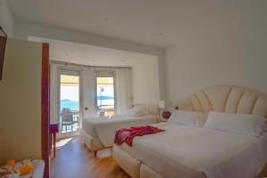 Кровать или кровати в номере Hotel Florida Lerici