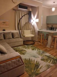 a living room with a couch and a table at LuxuryGetaway2 / Brand New 2BR / Fully Furnished / Wi-Fi / Full Kitchen in Sharm El Sheikh
