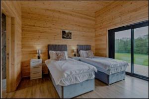 Ένα ή περισσότερα κρεβάτια σε δωμάτιο στο Meadow Valley Lodge 2