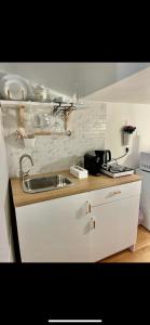 a kitchen with a sink and a counter top at Piazzetta Degli Innamorati in Bari +30 photos