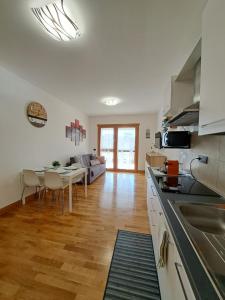 a kitchen and living room with a table and chairs at Angy's house Roma in Rome