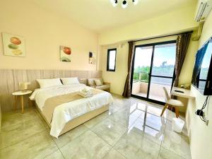Postel nebo postele na pokoji v ubytování 睡飽飽民宿 Sleeping Well B&B 全新電梯民宿