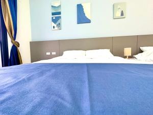 Postel nebo postele na pokoji v ubytování 睡飽飽民宿 Sleeping Well B&B 全新電梯民宿