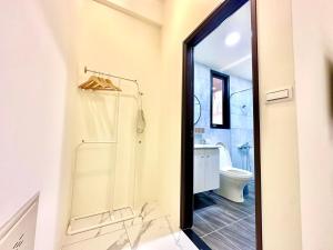 Koupelna v ubytování 睡飽飽民宿 Sleeping Well B&B 全新電梯民宿