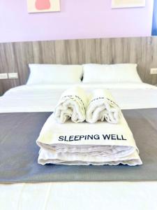 Postel nebo postele na pokoji v ubytování 睡飽飽民宿 Sleeping Well B&B 全新電梯民宿