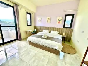 Postel nebo postele na pokoji v ubytování 睡飽飽民宿 Sleeping Well B&B 全新電梯民宿